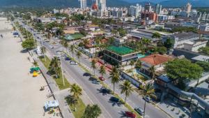 an aerial view of a city with a beach and buildings at Pousada Stand Up! Guarujá in Guarujá