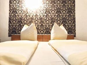Een bed of bedden in een kamer bij Reich Motel