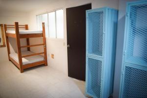 Postel nebo postele na pokoji v ubytování Downtown Hostel Chetumal
