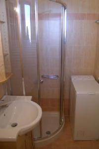 a bathroom with a shower and a sink at Villa Oscania in Georgioupolis