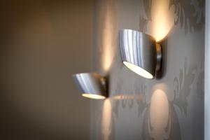 a wall mounted light fixture in a room at Vulcan Hotel Sydney in Sydney
