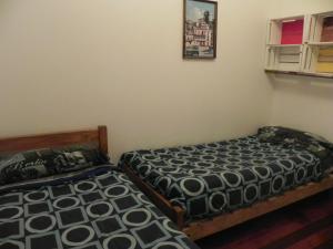 Postel nebo postele na pokoji v ubytování Lemuria Hostel