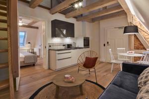 a living room with a couch and a table at VIA`s Appartements und Ferienwohnungen in Görlitz