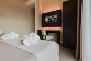 Posteľ alebo postele v izbe v ubytovaní Hotel Palazzo del Garda & Spa
