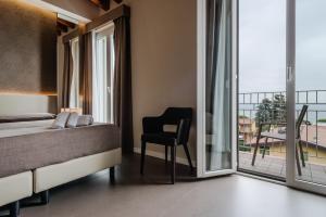 Posteľ alebo postele v izbe v ubytovaní Hotel Palazzo del Garda & Spa