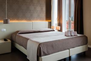 Posteľ alebo postele v izbe v ubytovaní Hotel Palazzo del Garda & Spa
