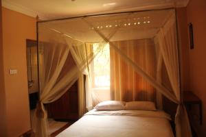 A bed or beds in a room at Saltek Forest Cottages