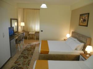 Postel nebo postele na pokoji v ubytování Onorato Hotel + 31 fotografií