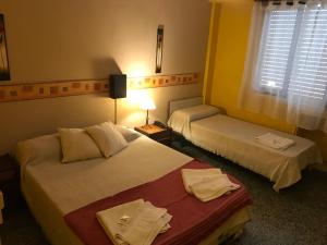 Una cama o camas en una habitación de Hotel Resi San Bernardo