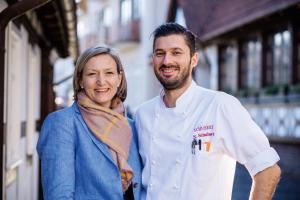 a man and a woman standing next to each other at Romantik Hotel Schubert in Lauterbach +25 photos
