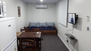 Uma televisão e/ou sistema de entretenimento em Complejo Containers DF