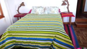 Letto o letti in una camera di Hostal Inti Wayra