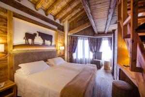 Ένα ή περισσότερα κρεβάτια σε δωμάτιο στο Hotel Pilier D'Angle & Wellness