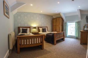 Кровать или кровати в номере The Cambrian Inn