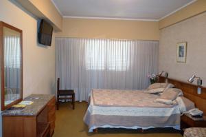 Llit o llits en una habitació de Hostal Santa Fe De La Veracruz
