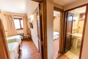 Postel nebo postele na pokoji v ubytování Tunqueley Hotel