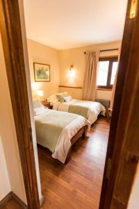 Postel nebo postele na pokoji v ubytování Tunqueley Hotel