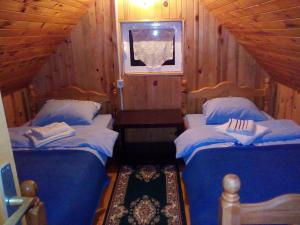a room with two beds in a cabin at Guesthouse Mijatovic in Žabljak +18 photos