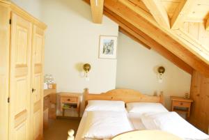 Postel nebo postele na pokoji v ubytování Casa Tödi Restaurant Hotel