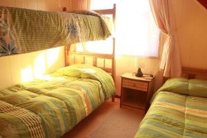 Poschodová posteľ alebo postele v izbe v ubytovaní Cabañas Don Gaspar