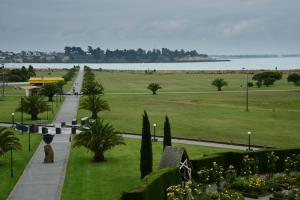 a view of a park with a body of water at The Ocean Breeze CBD in Timaru