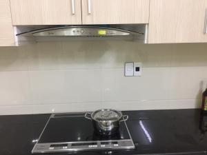 a pot sitting on top of a stove in a kitchen at Ngọc Anh Hotel in Ha Long