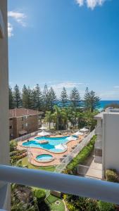 a view of a swimming pool at a resort at 2nd Avenue Beachside Apartments in Gold Coast