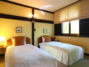 Postel nebo postele na pokoji v ubytování Hotel Hut Walden + 54 fotografií