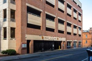 a red brick building with a sign that reads next moline at Trifecta 2BR Free Parking Modern Superhost in Durham