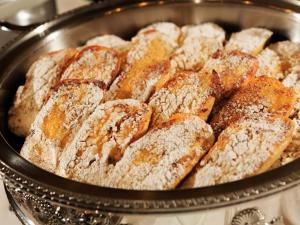 a pan filled with doughnuts covered in powdered sugar at Hotel Karuizawa Elegance in Karuizawa
