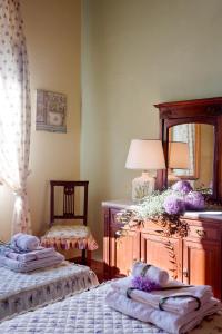 Postel nebo postele na pokoji v ubytování Agriresort & Spa Fattoria I Ricci