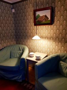 Posezení v ubytování Vargheden B&B och trädgård
