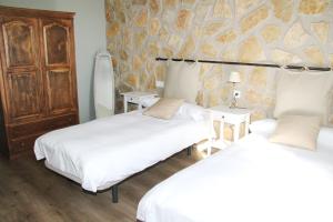 Łóżko lub łóżka w pokoju w obiekcie Casa Rural El Olivar de Valdefuentes