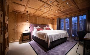 Postel nebo postele na pokoji v ubytování Tradition Julen Hotel