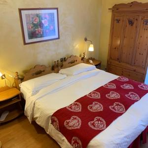 Postel nebo postele na pokoji v ubytování Meuble Villa Neve