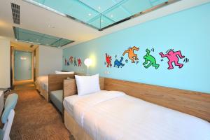 Postel nebo postele na pokoji v ubytování Green World Hotel - Zhonghua