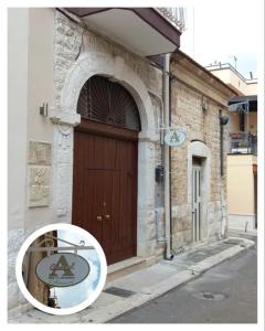 a door of a building with a sign in front of it at Almasol in Cassano delle Murge