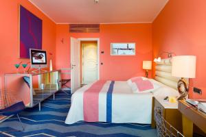 Postel nebo postele na pokoji v ubytování Seaside Palm Beach