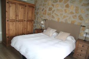 Łóżko lub łóżka w pokoju w obiekcie Casa Rural El Olivar de Valdefuentes