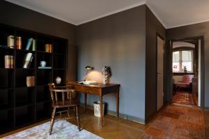 a room with a desk and a chair and a table at Victory Apartments in Stockholm +50 photos