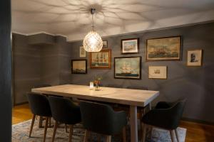 a dining room with a table and chairs at Victory Apartments in Stockholm