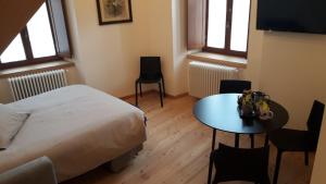 Letto o letti in una camera di Hotel Albrici