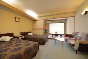 Postel nebo postele na pokoji v ubytování Mashikokan Satoyama Resort Hotel