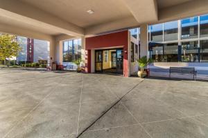 a lobby of a building with a large building at Clarion Hotel Jackson Northwest in Jackson