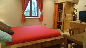 Katil atau katil-katil dalam bilik di Ferme familiale chez Lili