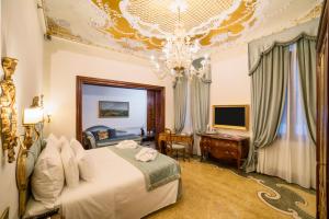 Postel nebo postele na pokoji v ubytování Hotel Ai Reali - Small Luxury Hotels of the World