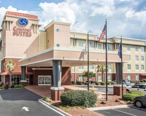 a front view of a hotel with two american flags at Comfort Suites Rock Hill Manchester Meadows Area in Rock Hill