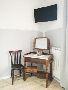 Televízia a/alebo spoločenská miestnosť v ubytovaní B&B Casa Dalma