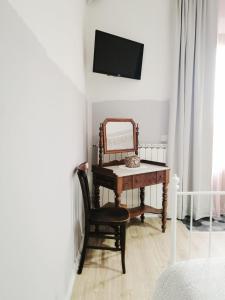 Televízia a/alebo spoločenská miestnosť v ubytovaní B&B Casa Dalma