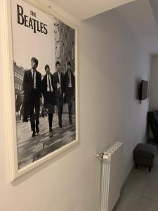 A television and/or entertainment centre at Rome Together Guest House